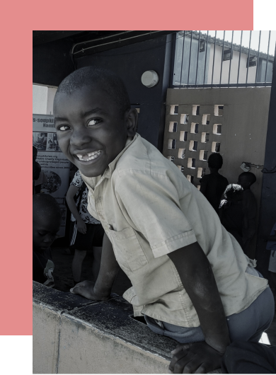 Young boy playing and smiling
